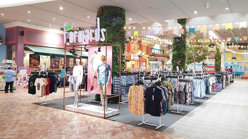 a Forwards op-up market in the basement of a mall in Bangkok with clothing on display