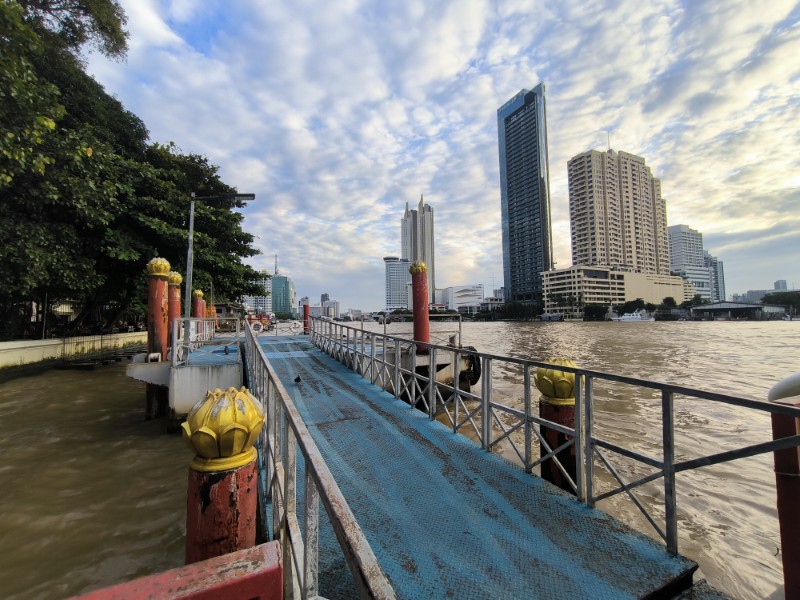 Chao Phraya river pier with Bangkok skyline