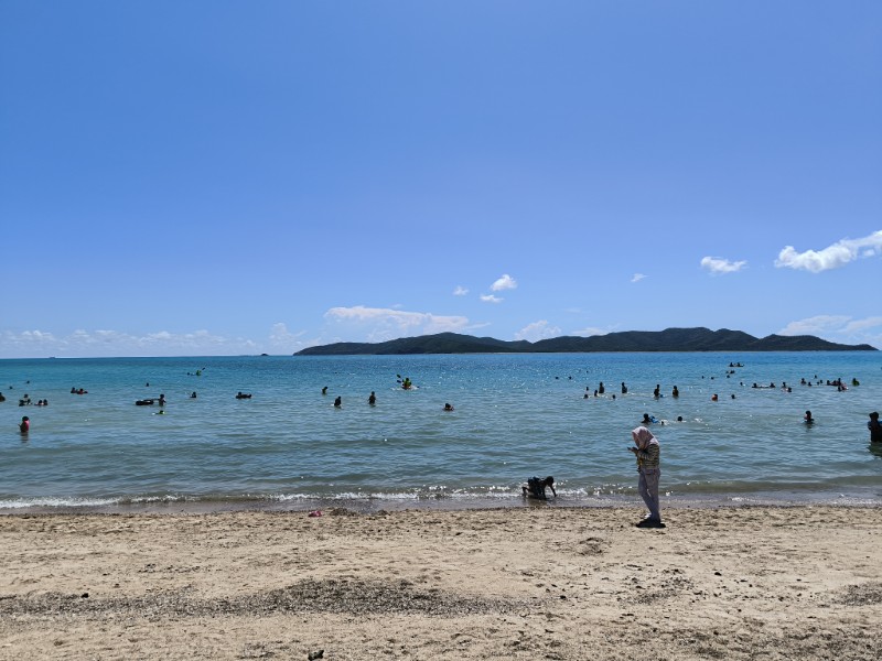 Beach with swimmers in Hua Hin