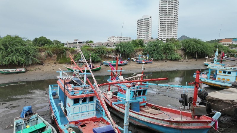 Colorful fishing boats in Hua Hin's harbor
