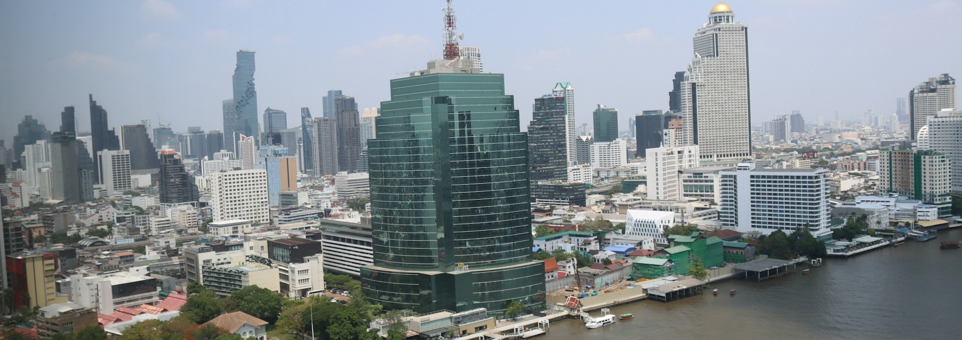 Bangkok skyline along the Chao Phraya River at Silom and Charoen Krung