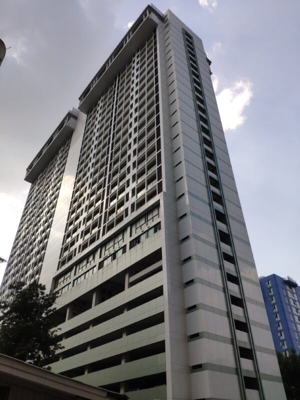 High-rise condominium tower in Bangkok seen from street level
