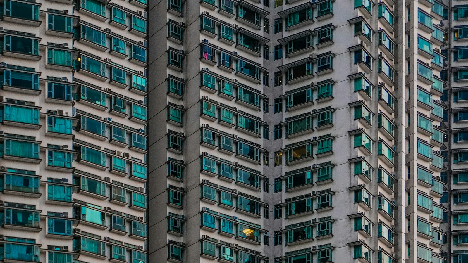 Facade of a modern condominium building with many units