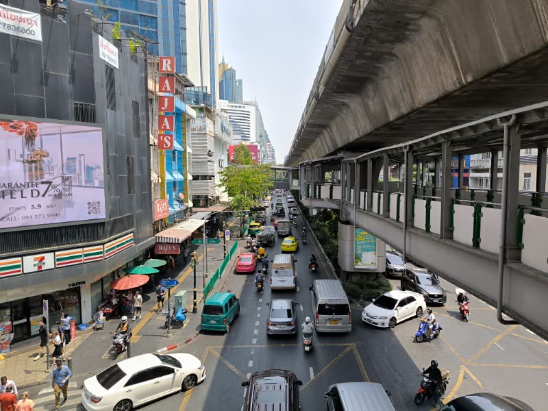 Busy Sukhumvit street with the BTS Skytrain overhead