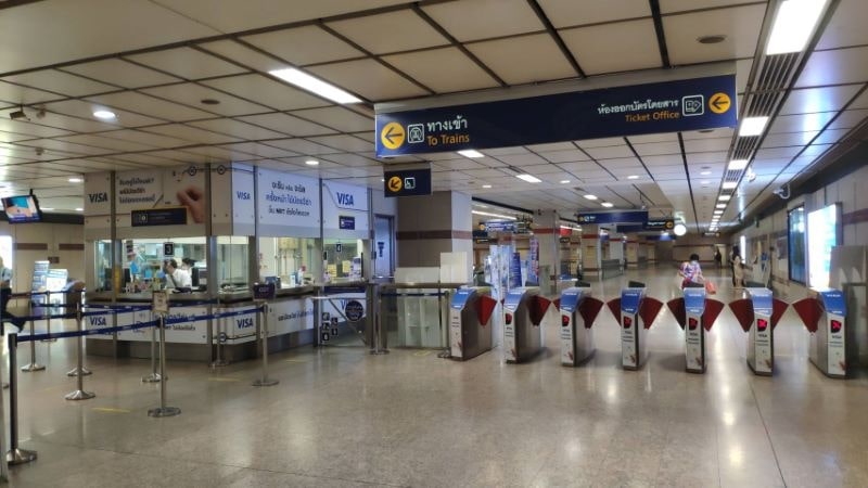 Ticket gates and ticket office at an SRT Red Line station between Don Mueang and Bang Sue