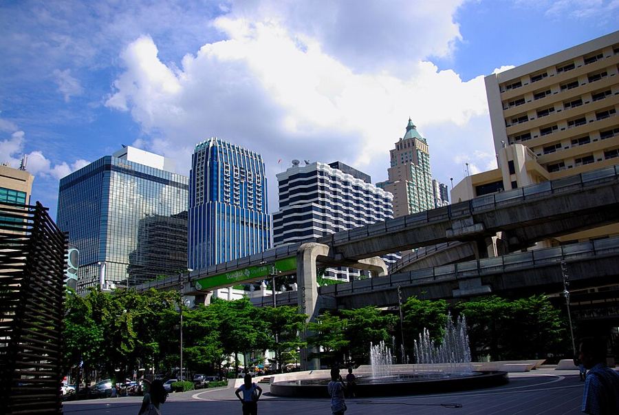 BTS Skytrain tracks curving past office towers in front of CentralWorld at Ratchaprasong, Bangkok