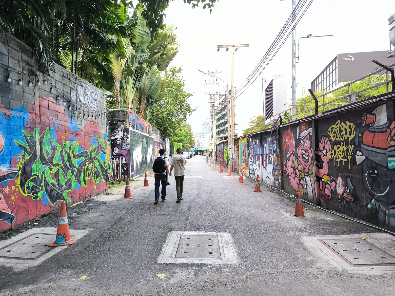 A lane lined with street art walls off Charoen Krung Road