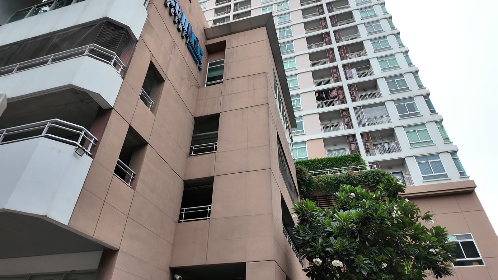 A mid-rise condo building near BTS Punnawithi
