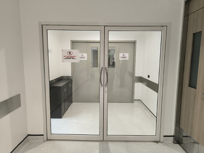Doors to a staff-only hospital area in Bangkok