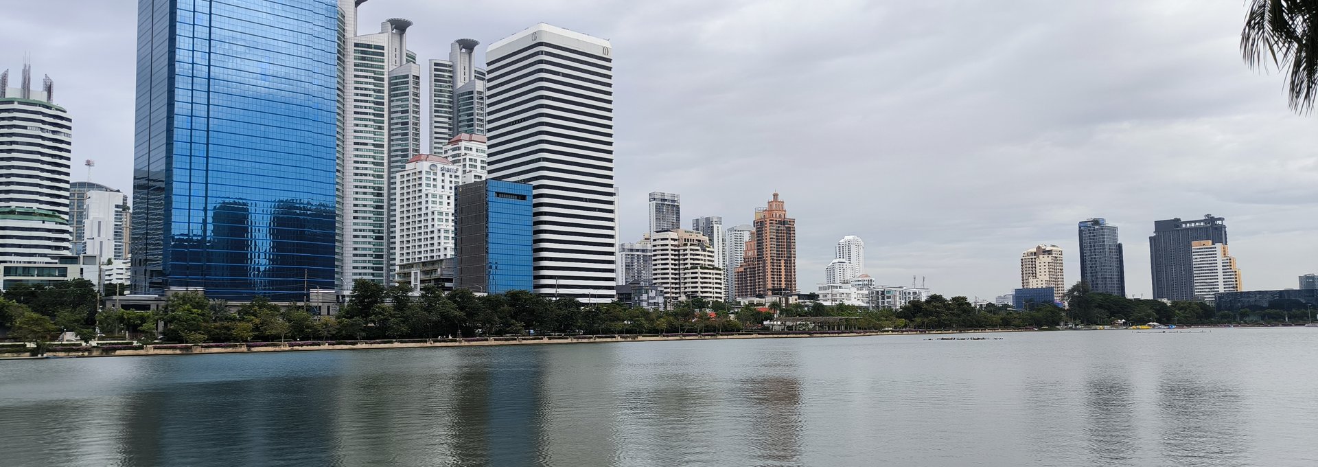Benjakitti Park lake with the Asok skyline, Bangkok