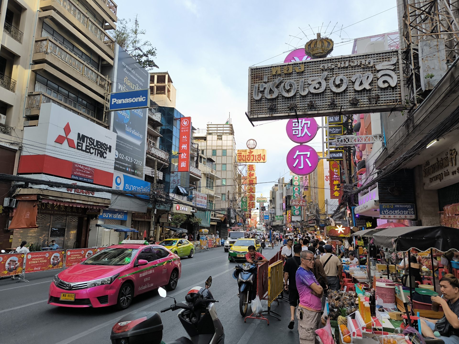 Yaowarat Road in Chinatown with shop signs and evening stalls
