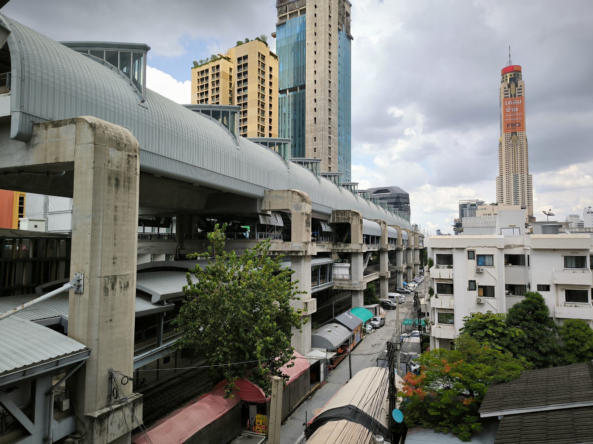 View from the Airport Rail Link at Phaya Thai over the rooftops toward Baiyoke Tower