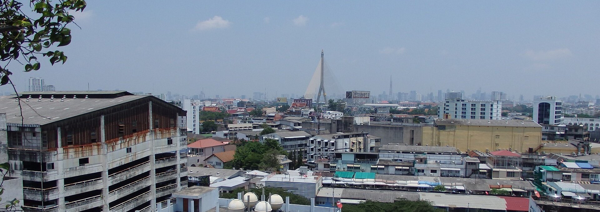 Rooftops of Bang Yi Khan in Bang Phlat, Pinklao, with a cable-stayed bridge on the Bangkok skyline