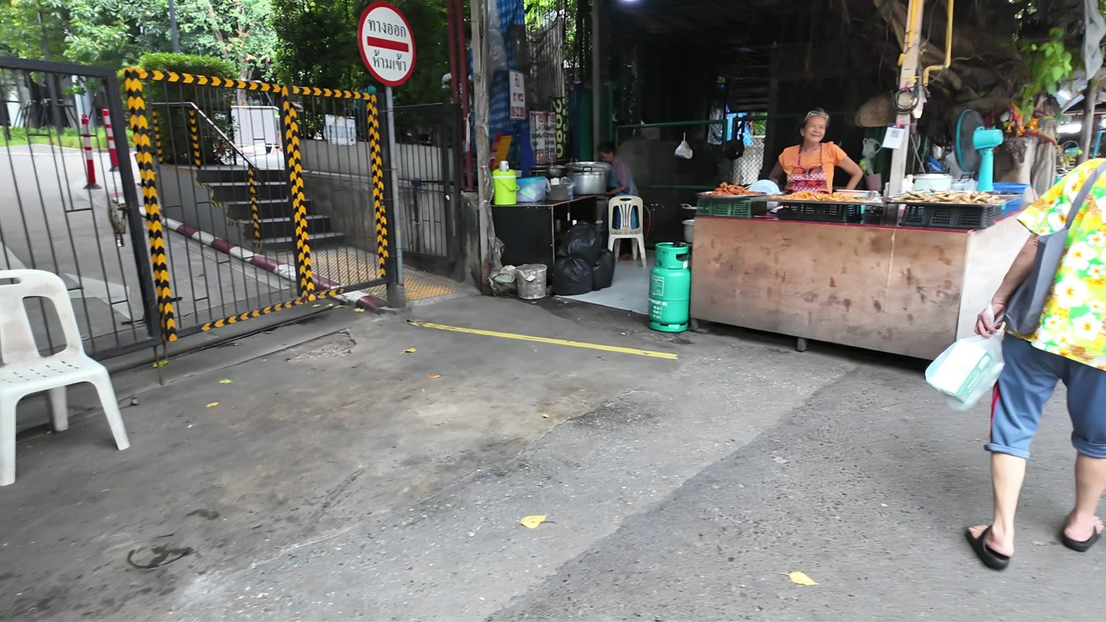 A street food stall in a side lane near True Digital Park