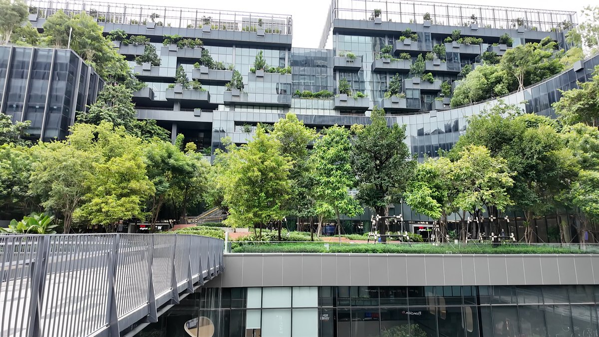 Terraced green building and tree-lined garden at True Digital Park, Punnawithi, Bangkok